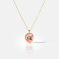 Necklace with a pink pendant on a white background