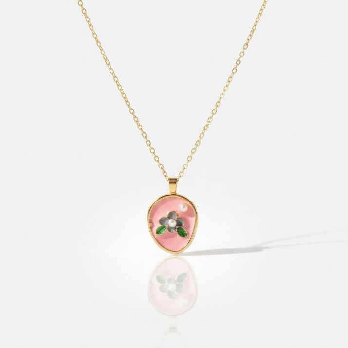 Necklace with a pink pendant on a white background