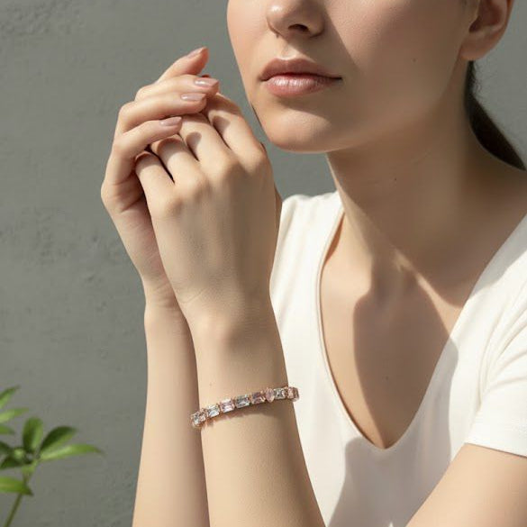 Woman wearing a bracelet with a neutral background