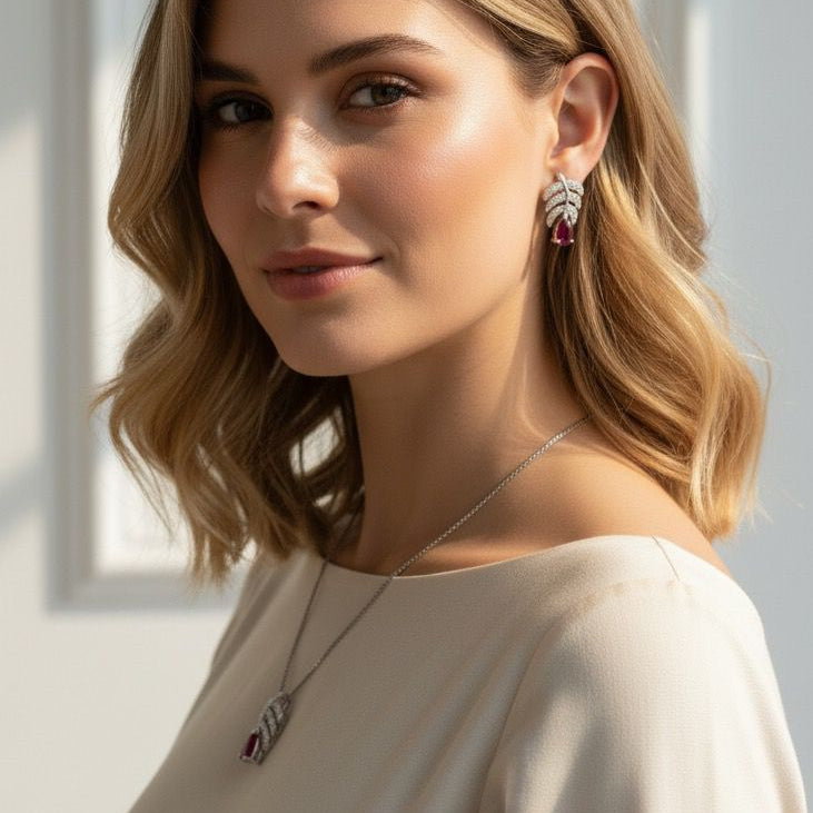 Woman wearing jewelry against a white wall