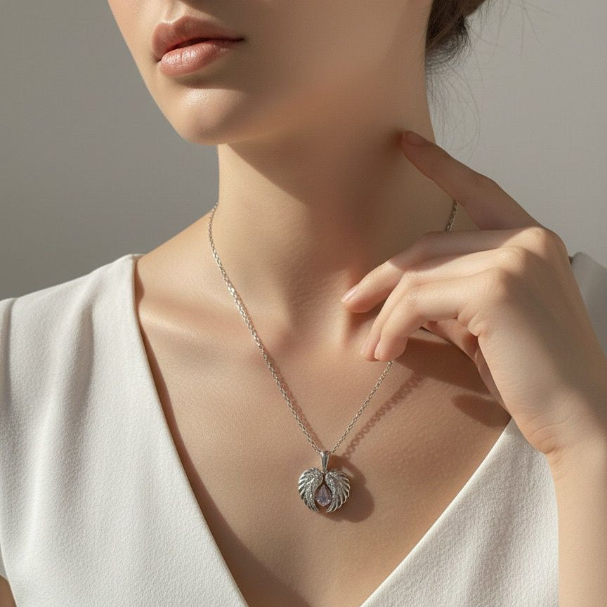 Woman wearing a necklace with a pendant, touching her neck