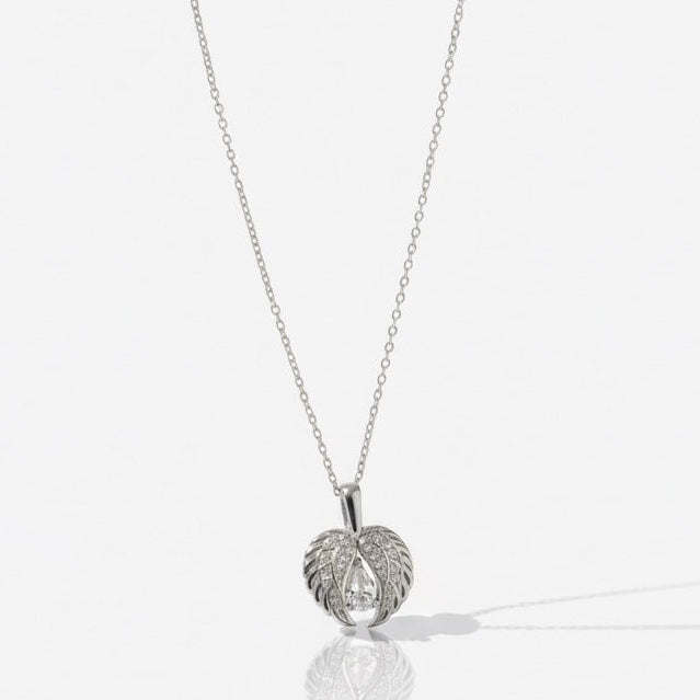 Silver necklace with a leaf-shaped pendant on a white background