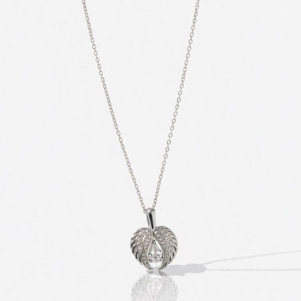 Silver necklace with a leaf-shaped pendant on a white background