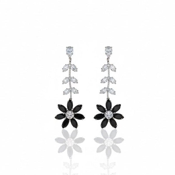 Pair of floral earrings with black and silver details on a white background