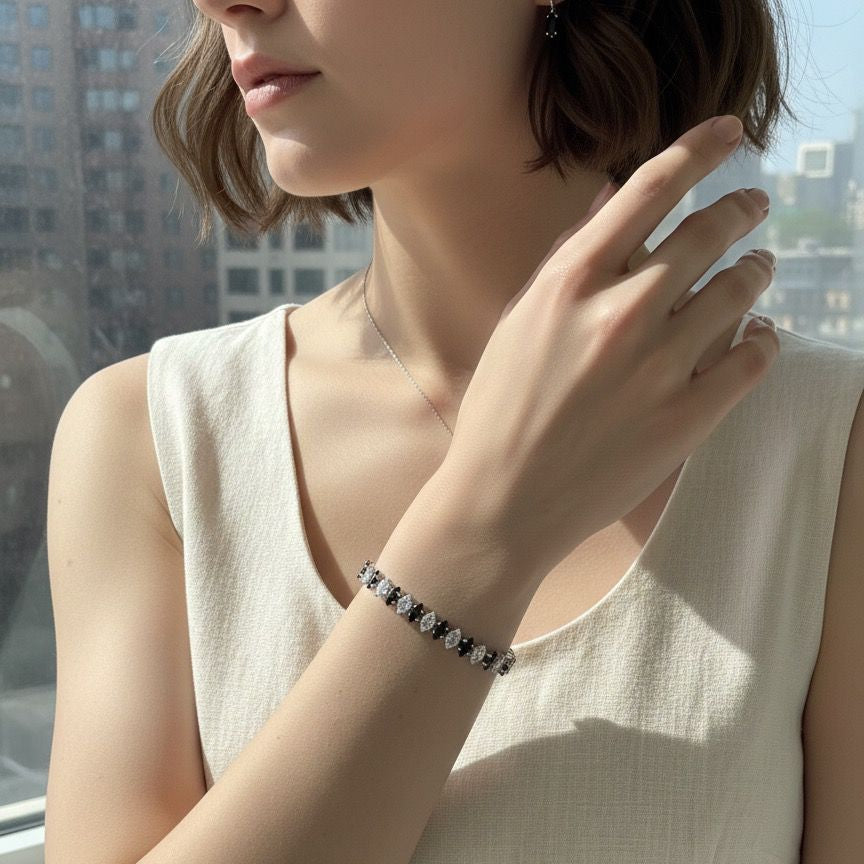 Person wearing a bracelet with a cityscape in the background