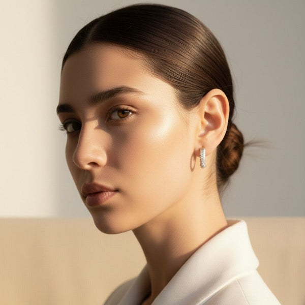 Woman wearing a white blazer with a neutral background