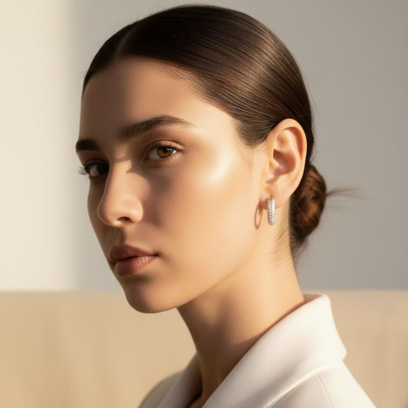 Woman wearing a white blazer with a neutral background