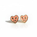 Heart-shaped earrings on a white background