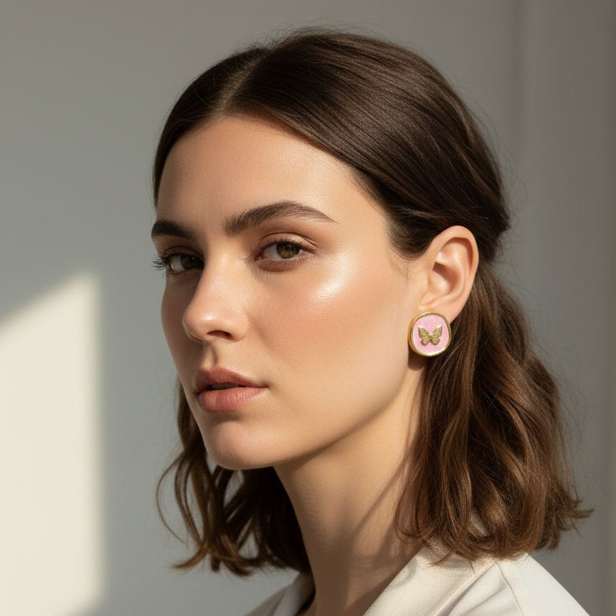 Woman wearing earrings with a neutral background