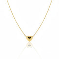 Gold heart-shaped pendant necklace on a white background