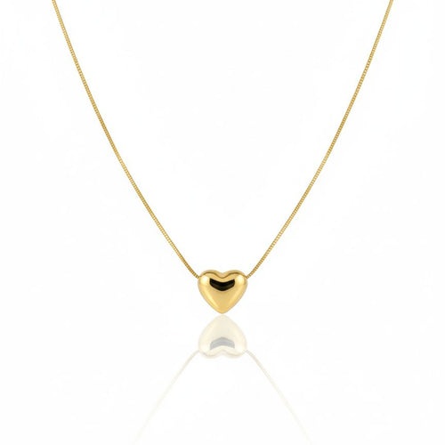 Gold heart-shaped pendant necklace on a white background