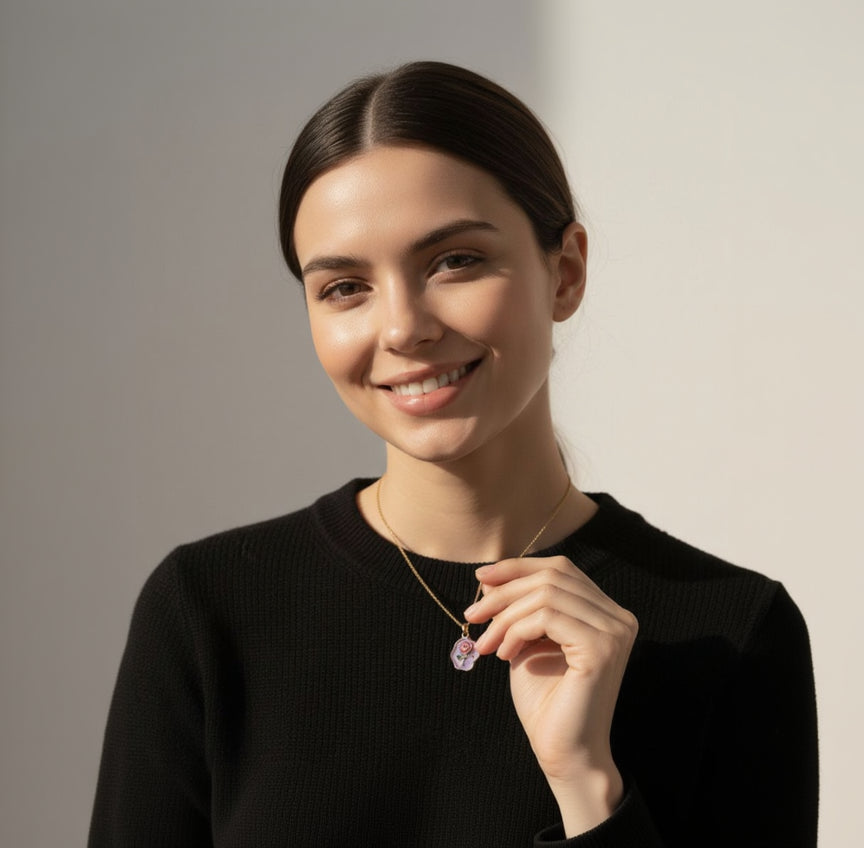 Woman wearing a necklace with a clear pendant against a neutral background