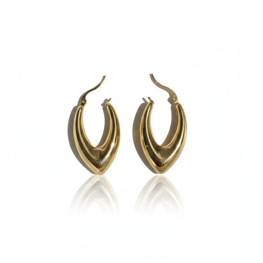 Gold hoop earrings on a white background